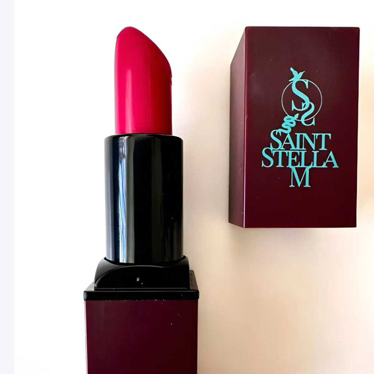 Shop Saint Stella M Sweet Magnolia & Me Lipstick, a vibrant pink-red with a creamy, long-wear formula. It is part of The Six Faces Of Empowerment collection and is available online now at The DO Salon.