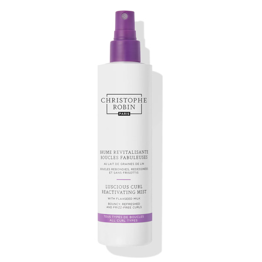 Revive your curls with Christophe Robin Luscious Curl Reactivating Mist. Milky mist instantly reactivates curl definition between washes, taming frizz and providing hydration. Formulated with Flaxseed Milk and nourishing oils, it enhances shine and bounce. Perfect for all curl types. Shop now at The DO Salon.