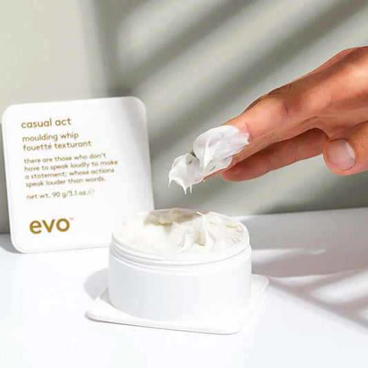 Discover Evo Casual Act Moulding Paste for a style that's as versatile as you are. Lightweight yet powerful paste offers effortless control, definition, & a touchable hold for all hair types. Enhance your styling routine with ease & enjoy touchable texture, separation, & definition with a hint of citrus, woody notes. 2