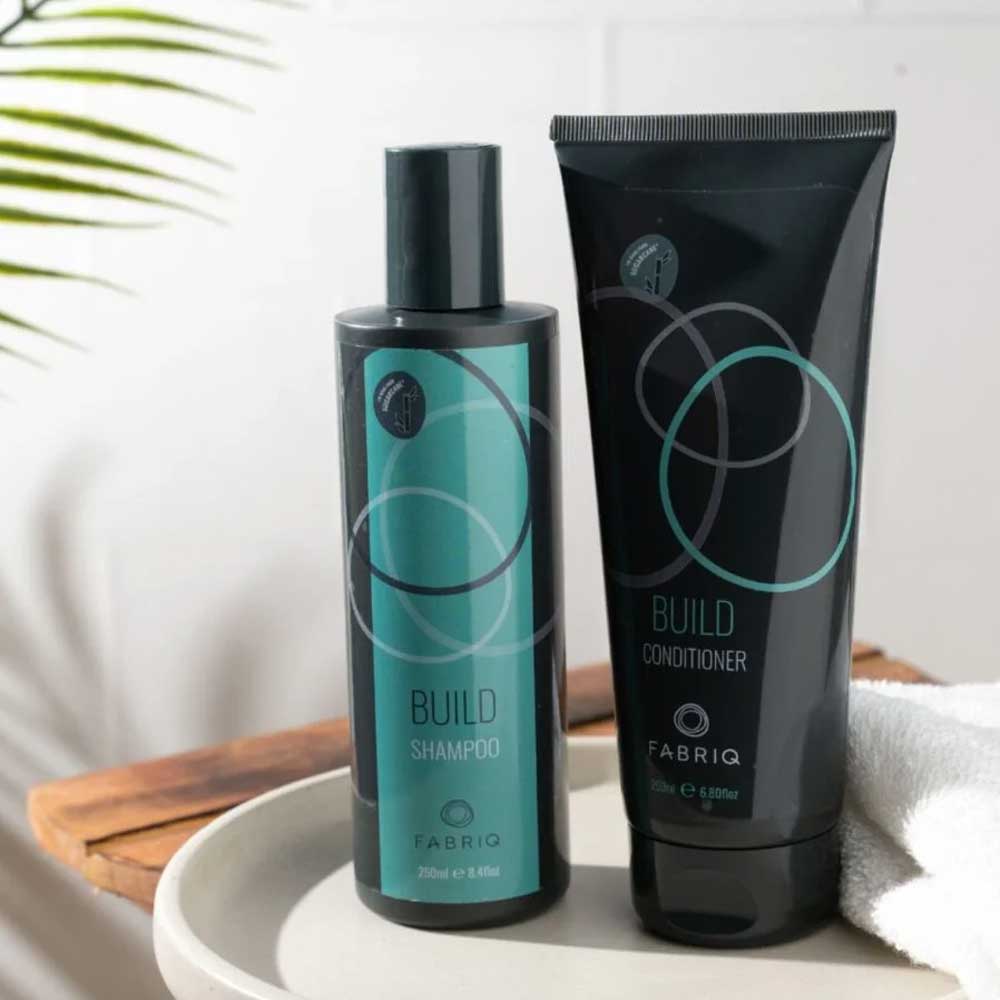 Fabriq Build Shampoo and Conditioner: The perfect duo to cleanse, strengthen, and nourish chemically treated or fragile hair. Boost softness and shine with every wash. Available at The DO Salon, St Kilda.