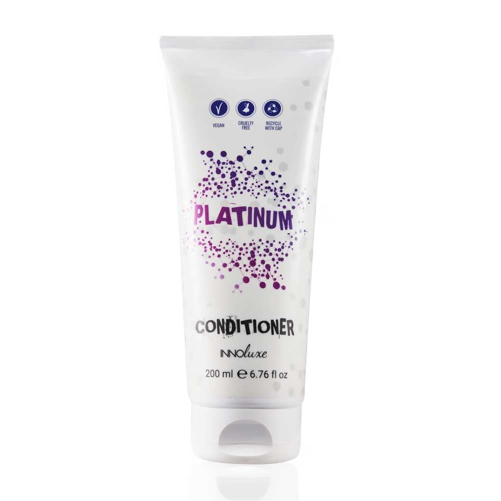 Shop INNOluxe Platinum Conditioner at The DO Salon in St Kilda, Melbourne. This lightweight violet conditioner neutralizes brassy tones, hydrates, and adds shine for cooler blonde results. Perfect for natural and coloured blonde hair. Buy now for silky, frizz-free hair! Buy today online or in-salon. 200ml