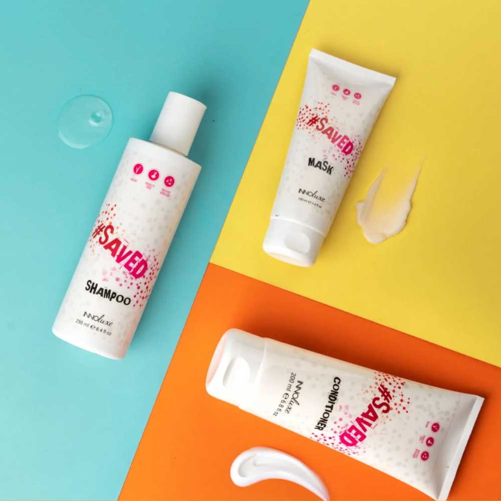 Showcasing the INNOluxe #SAVED range: shampoo, conditioner, and mask. Hydrate, strengthen, and protect hair while enhancing colour vibrancy. Perfect for all hair types. Available at The DO Salon in St Kilda, Melbourne.