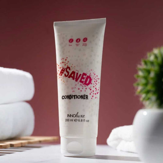 Hydrate and protect color-treated hair with INNOluxe #SAVED Conditioner 200ml. Adds shine, softness, and long-lasting color vibrancy. Shop now at The DO Salon! lifestyle image
