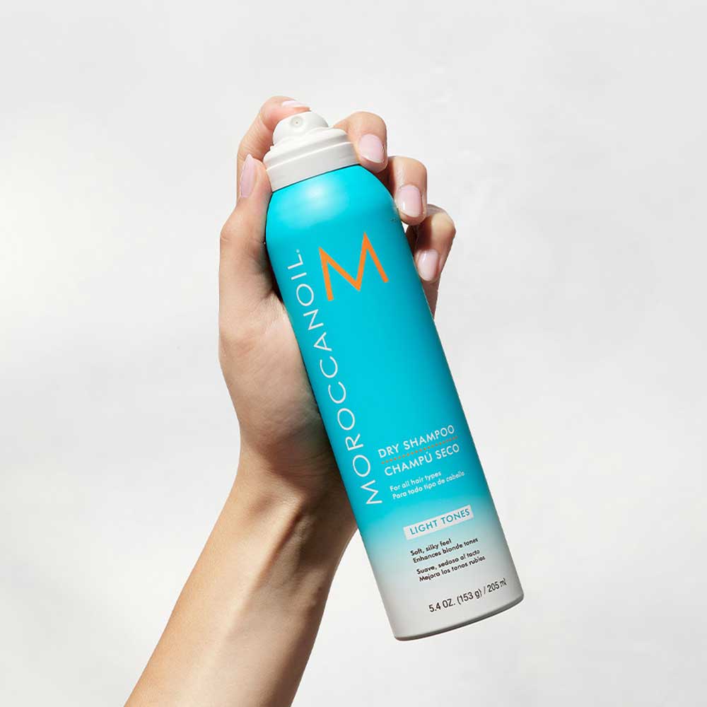 Keep blonde hair fresh and brass-free with Moroccanoil Dry Shampoo Light Tones (205ml). Cleanses, refreshes, and protects with UV defense and argan oil. Shop now at The DO Salon in St Kilda, Melbourne! 2