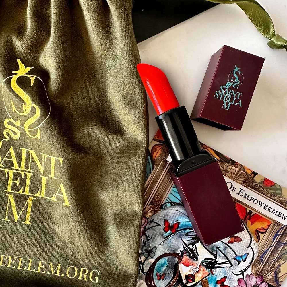 Shop Saint Stella M Sweet Magnolia & Me Lipstick, a vibrant pink-red with a creamy, long-wear formula. It is part of The Six Faces Of Empowerment collection and is available online now at The DO Salon. lifestyle